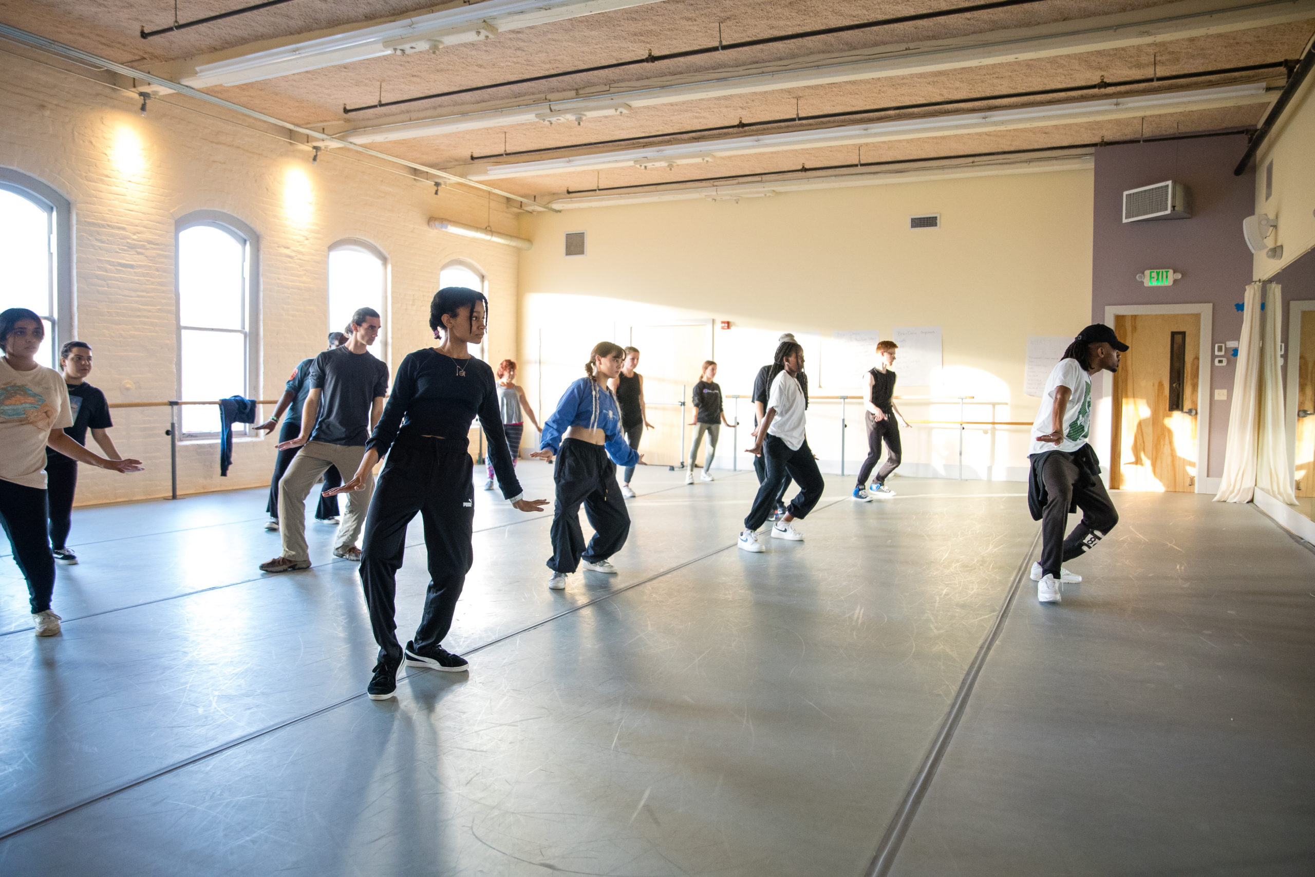 A group of students in a hip hop class