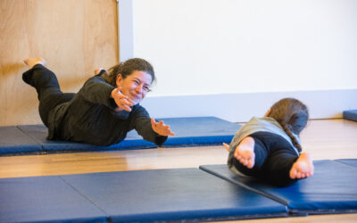 A teacher and student in a tumbling class.