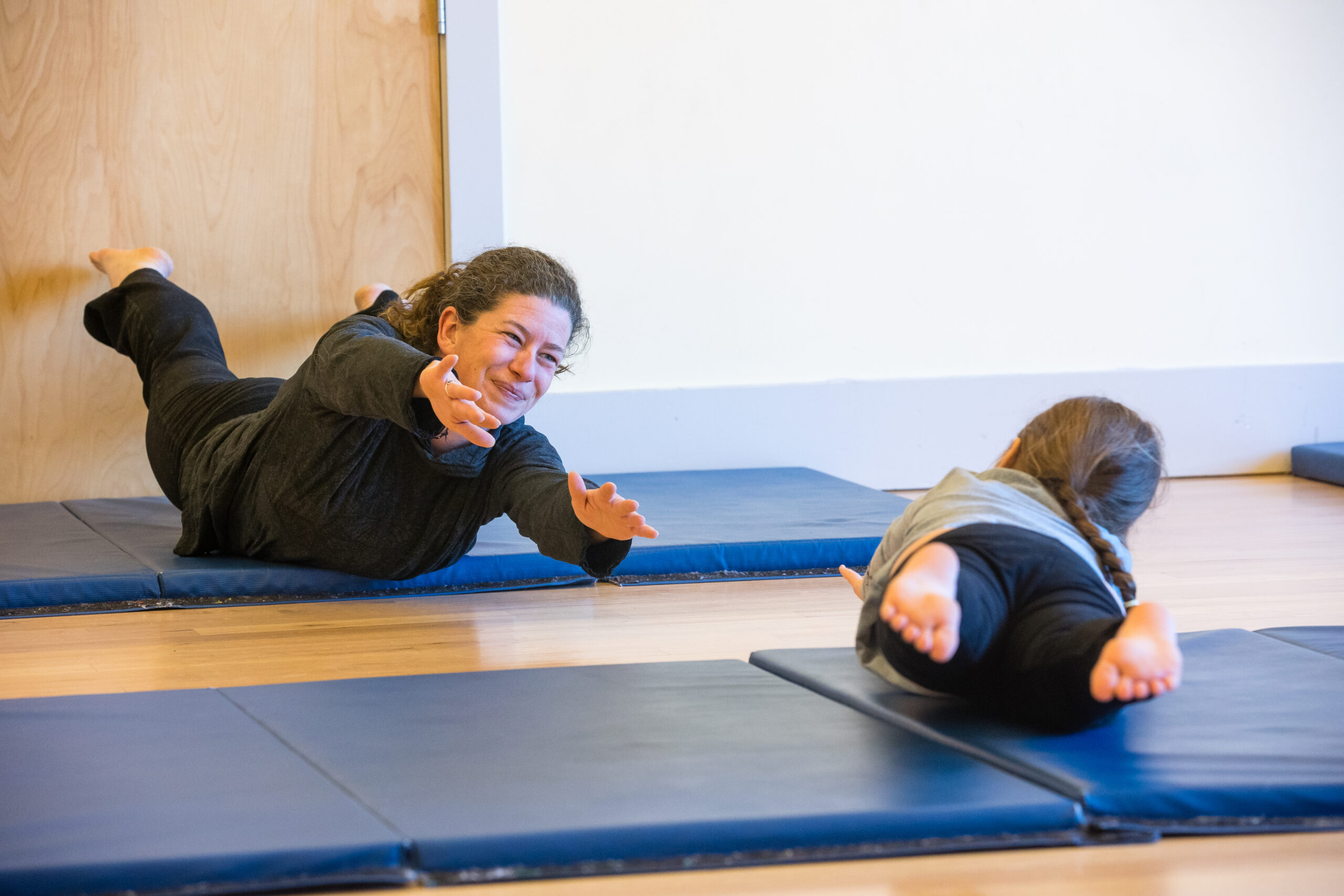 A teacher and student in a tumbling class.