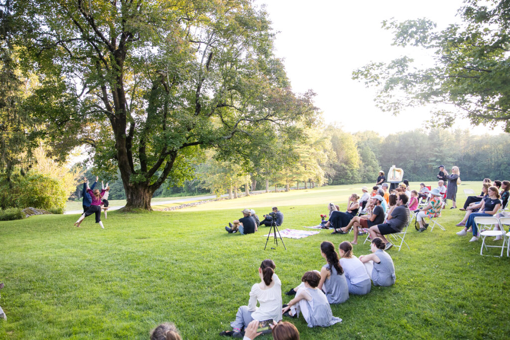 Audience on Chesterwood lawn watching one of the performances 