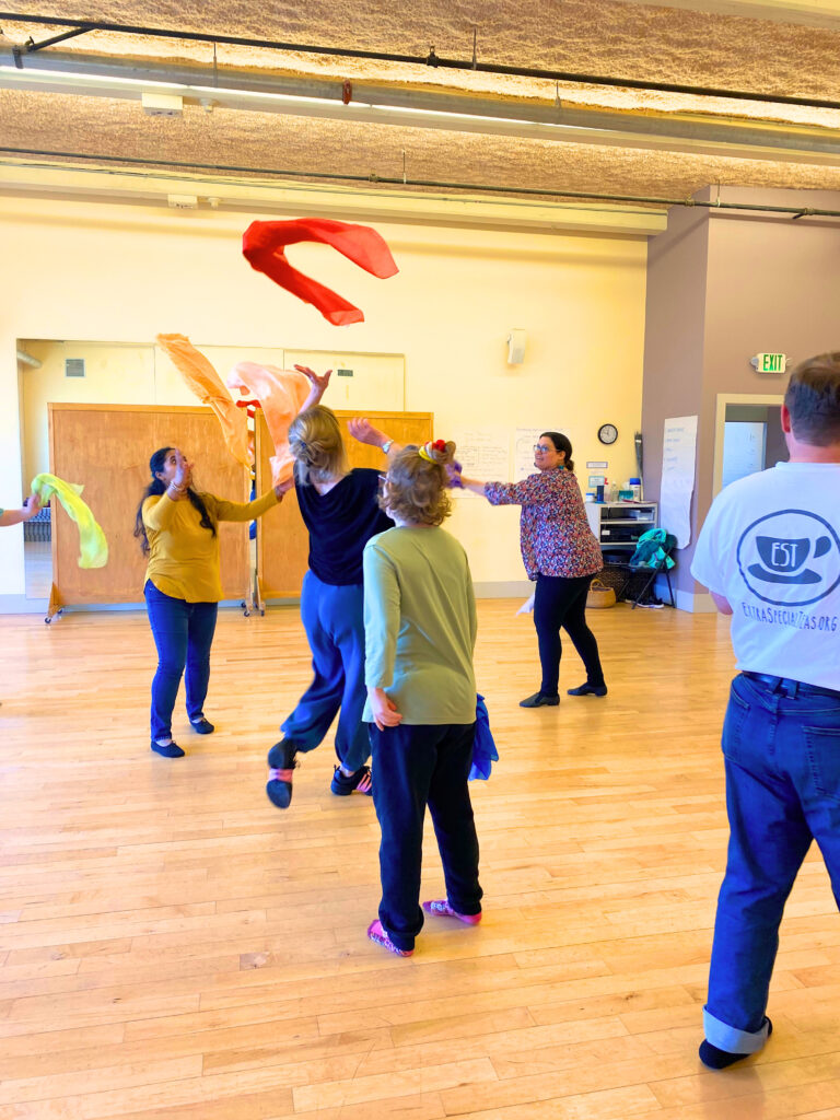 Photo of EST Dancers throwing scarves